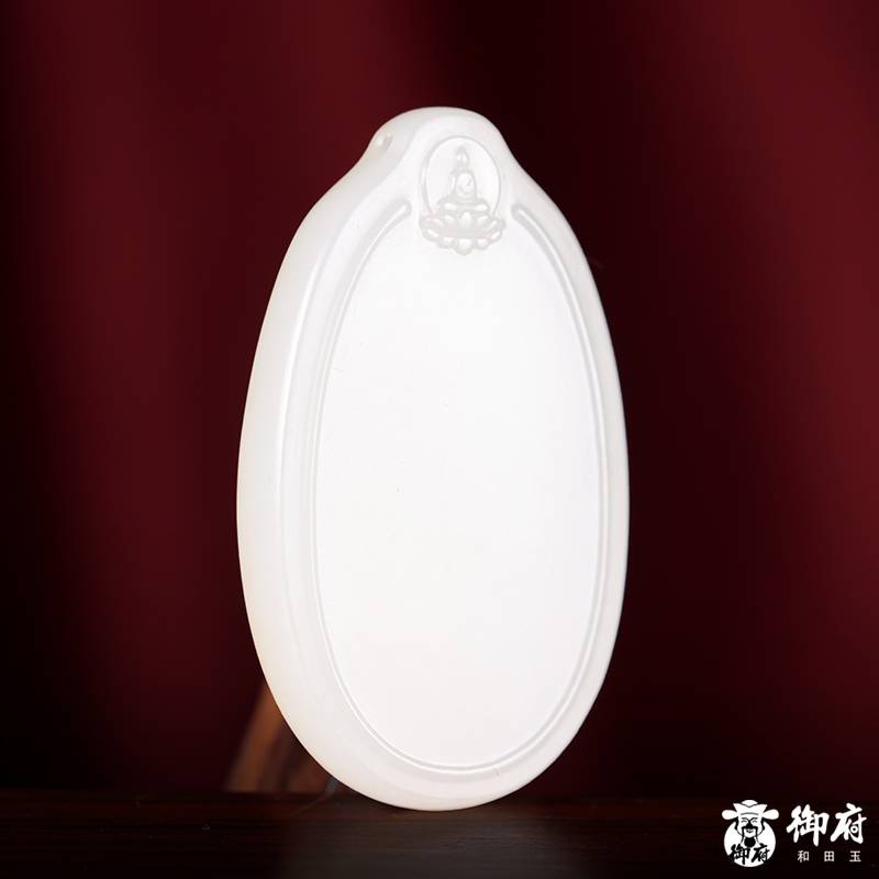 Detail of natural gold skin on a white Hetian jade peace plaque