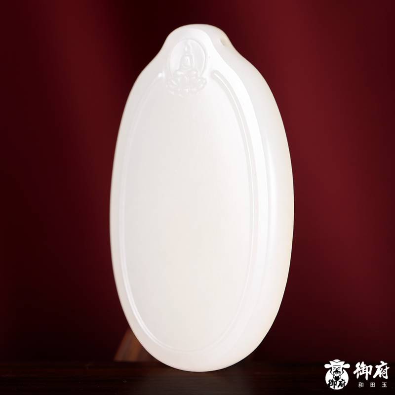 Side view showing the slim profile of a 10.5 gram Hetian jade peace plaque
