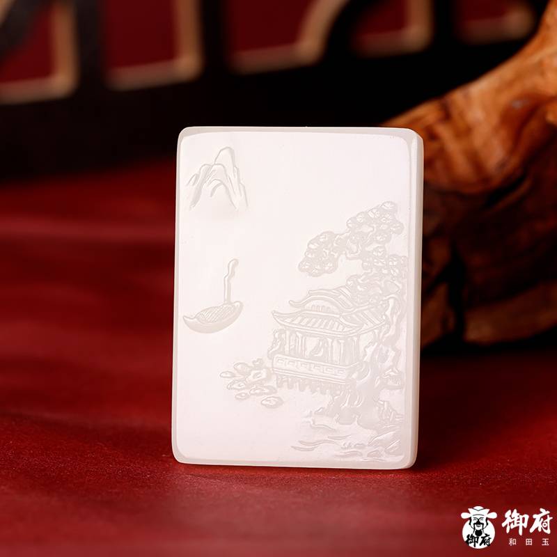 Detailed landscape relief carving on a Hetian jade plaque
